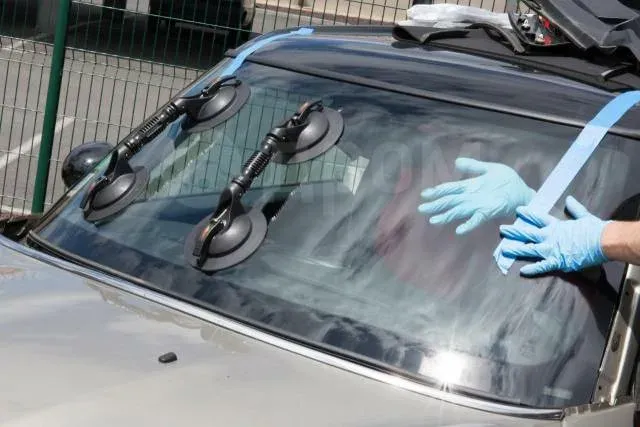 Glass Inc technician replacing a windshield